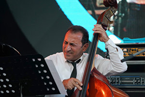 A member of the band lead by Vahagn Hayrapetyan (Armenia) performs at the 16th Koktebel Jazz Party international music festival
