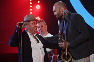 Saxophonist Sergei Golovnya, right, and musician Vahagn Hayrapetyan, left, perform during the All Stars KJP Jam with the participation of the big band lead by Sergei Golovin, at the 16th Koktebel Jazz Party international music festival